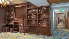 An image of a souvenir shop with a wooden cupboard with artefacts - Sarovar Premiere, Srinagar